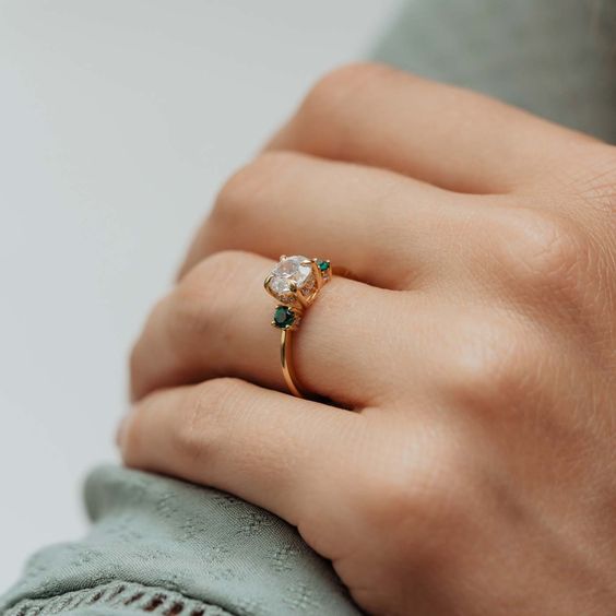 emerald accent engagement ring
